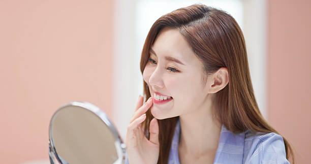 istock asian woman satisfied her teeth 2255664095
