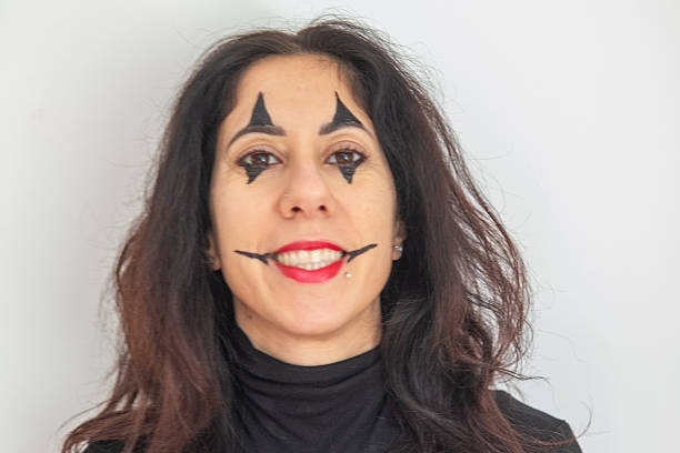 The images are part of a series of portraits made of a woman with clown makeup for Carnival. The woman is about forty years old and of Italian origin