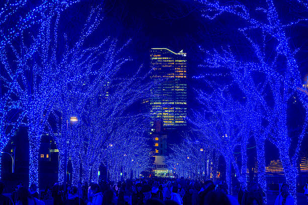 People walking against a backdrop of illuminations