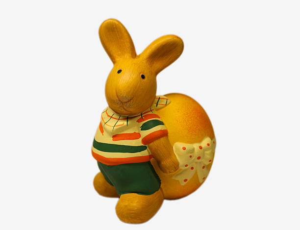 Cheerful Yellow Bunny Figurine With Egg, Cottagecore Tabletop Display Evoking Nostalgic Spring Vibe
