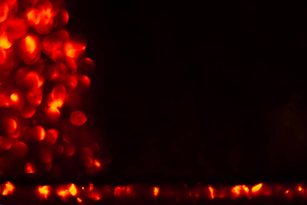 Abstract Red Bokeh Lights on Dark Background for Festive and Artistic Design