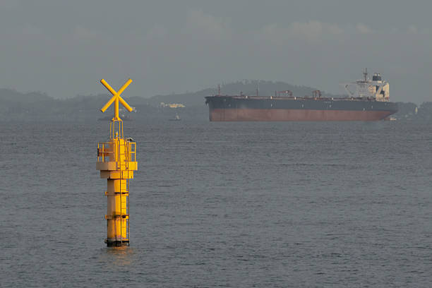 Yellow buoy marker at the Straits of Singapore water, telephoto view from Marina Barrage