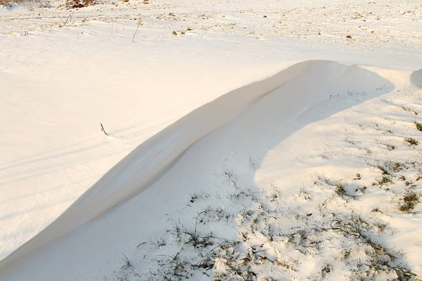 Snowcapped white hills on white background (cut out).
