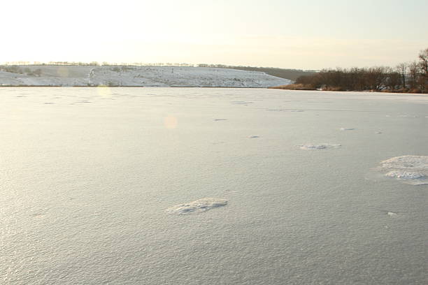 an ice-covered river in winter, a beautiful landscape in nature in the cold winter season on the river