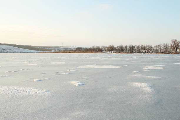 Snowy rural landscape with hoarfrost on the trees a beautiful winter day