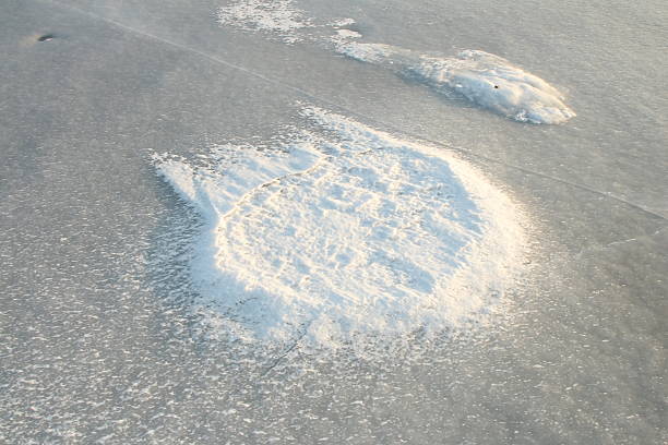 A large crater in the ground. Outdoor. Nature. Shore. Wave. Abstract