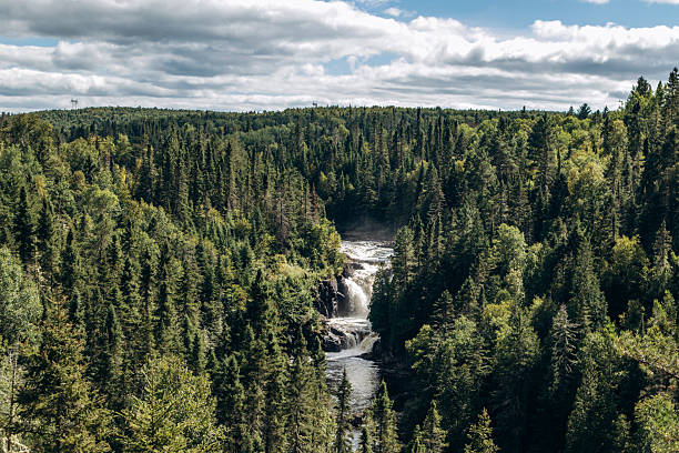 Waterfalls and rapids of Seguin River rushing over the bedrock of Canadian Shield in Parry Sound, Ontario, Canada