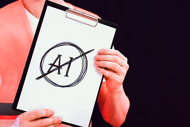 Person in orange vest holding paper with sketched prohibition sign over AI acronym
