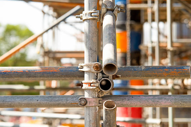 Close-up at scaffold parts, tubes and joints installed on building site