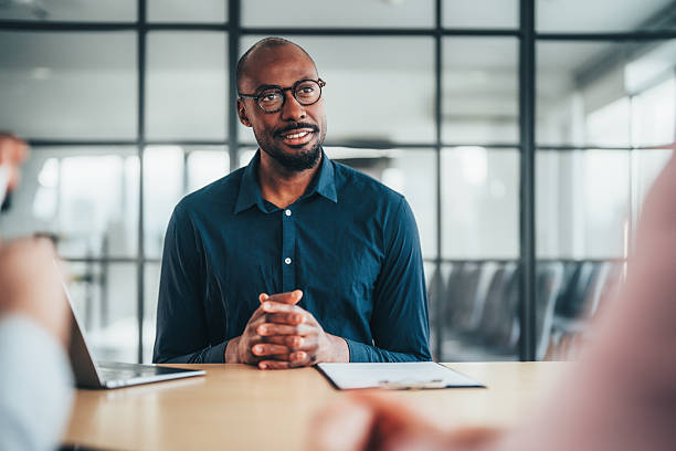 istock Insurance agent consulting clients in a modern office 2255727895
