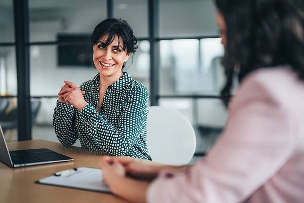 istock Professional business colleagues having a conversation in modern office setting 2255727915