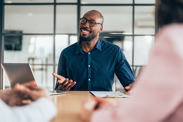 istock Insurance agent consulting clients in a modern office 2255727922