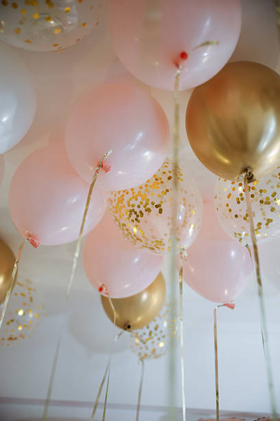 istock Bride letter balloons in hotel room 2255749098
