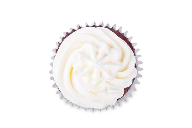 Chocolate cakes with vanilla cream frosting on a white isolated background. troning