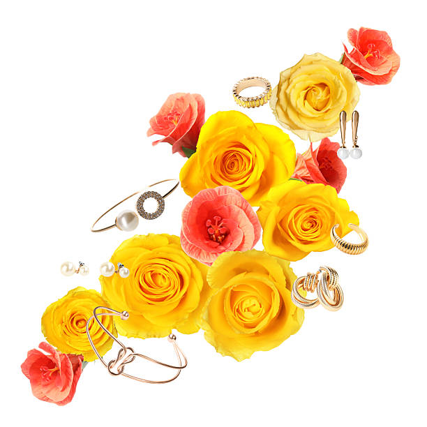 Shiny bijouterie and beautiful flowers air on white background
