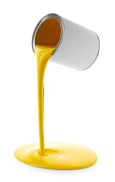 istock Yellow paint flowing down from can on white background 2255768130