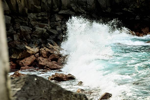 A Large wave crashed against the rocks and create a wall of spray in the resort of Puerto De La Cruz, Tenerife.