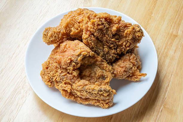istock Crispy fried chicken in white plate on wood table 2255778724