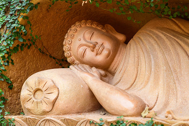 Da Nang, Vietnam: the Happy Buddha, commonly referred to as the Laughing Buddha or Maitreya (aka aka Budai or Hotei), is a golden statue outside Phap Lam Pagoda in the Hai Chau District, depicting the future Buddha in a joyful, portly form that symbolizes prosperity, happiness, and abundance in Buddhist culture. Positioned amid lush gardens with bonsai trees. This statue attracts visitors and practitioners seeking reflection, particularly on the 1st and 15th lunar days.