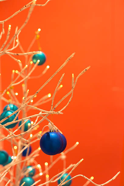 Gold Christmas Tree with Decorations, Vibrant Orange Background