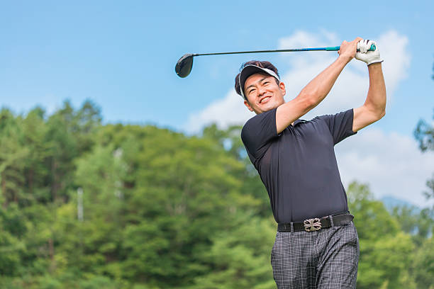 istock Male golfer playing golf on a golf course (smiling, tee shot, golf competition) 2255794714
