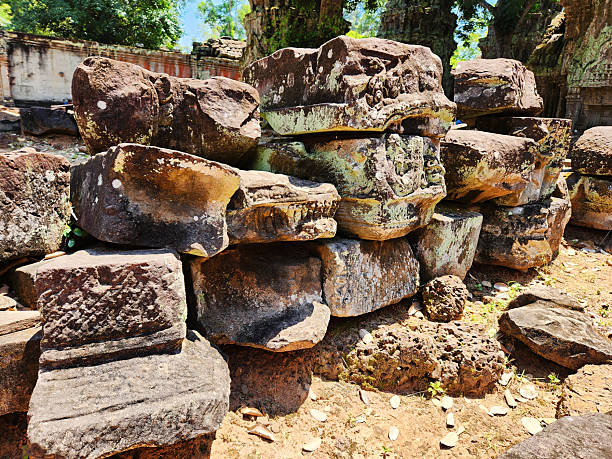 A pile of loose carved stones at a jungle temple at Angkor Wat