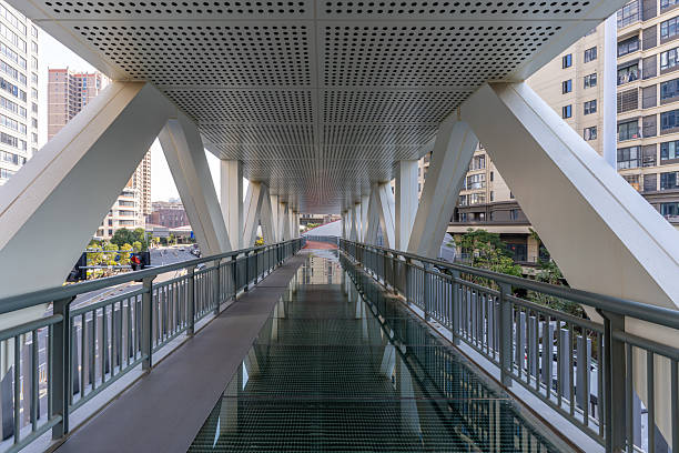 A pedestrian overpass of glass walkway