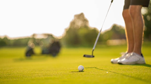 istock Golfer Concentrating on Precise Putt in Sunny Weather 2255825336