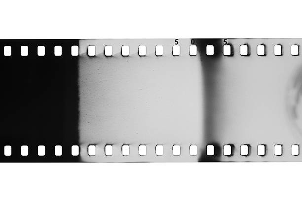 35mm black and white film with light leaks isolated on a white background.