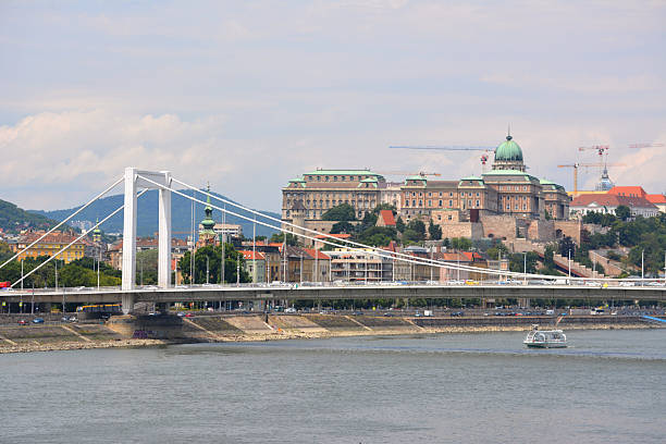The Elisabeth Bridge, connecting Buda and Pest across the River Danube. The bridge spanning only 290 m. It is named after Elisabeth of Bavaria, a popular queen and empress of Austria-Hungary, who was assassinated in 1898. In the distance, the Buda Castle.