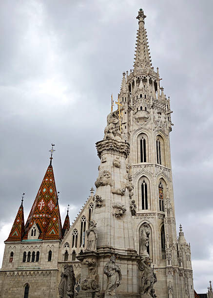 Holy Trinity Statue and Bell tower at the Church of the Assumption of the Buda Castle, more commonly known as the Matthias Church in Holy Trinity Square, Budapest, Hungary.The current building was constructed in the florid late Gothic style in the second half of the 14th century and was extensively restored in the late 19th century. It is a historic building with an important history.
