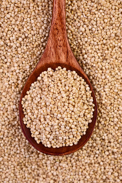 Quinoa in a wooden spoon. Close-up. View from above. Superfood.