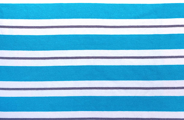Blue and white style striped fabric texture. Background with  striped closeup weave fabric. Pinstripe material of light azure and white color
