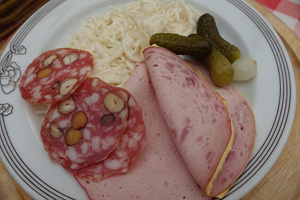 Charcuterie platter served with celery remoulade and gherkins