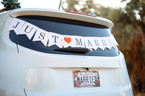 Wedding decoration on the car. White flowers and \