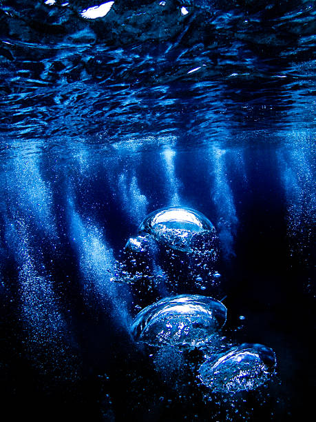 Underwater raising divers compressed air tank bubbles.