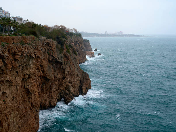 Panoramic view of the famous falez cliffs of Antalya under a cloudy sky.