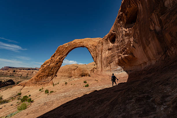 Elephant Arch, unique sandstone formation in Arches National Park Utah under bright sky.