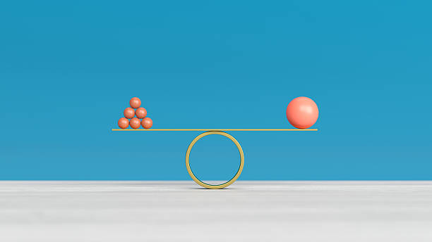 istock Abstract balls on scales. Solution of multiple problems and balance between them. blue background 2255860046