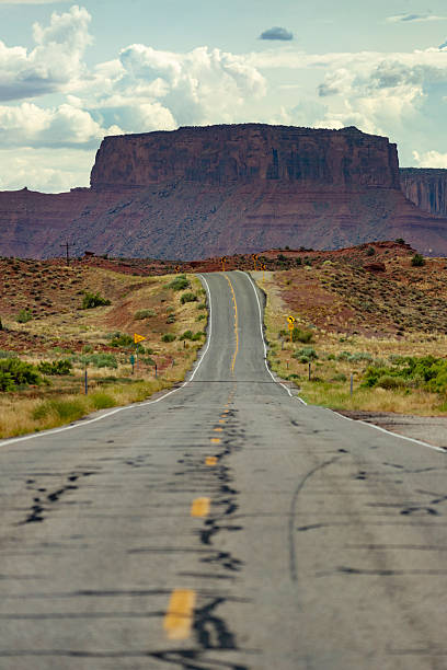 istock Empty road leading toward red rock cliffs in Capitol Reef National Park 2255861534