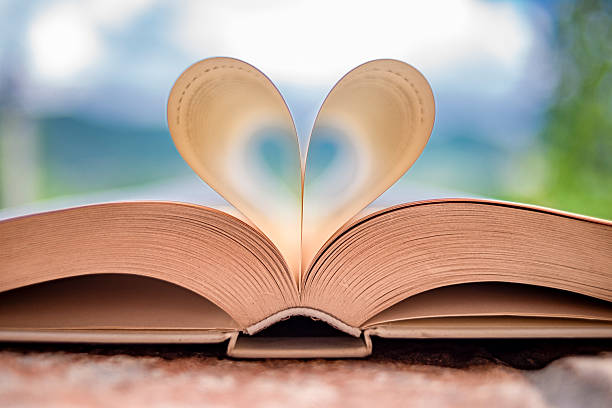 Open book with heart-shaped pages