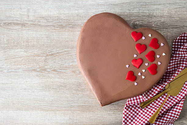 Heart-shaped gingerbread cookies on wooden table