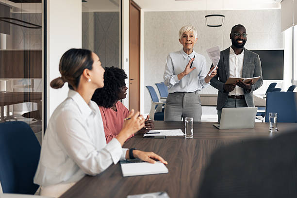 istock Diverse business professionals having meeting collaborating in modern office boardroom 2255863645
