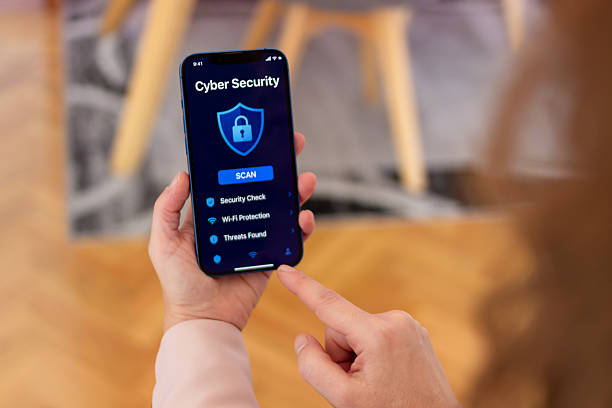 istock Woman holding phone scanning for cyber security threats 2255863778