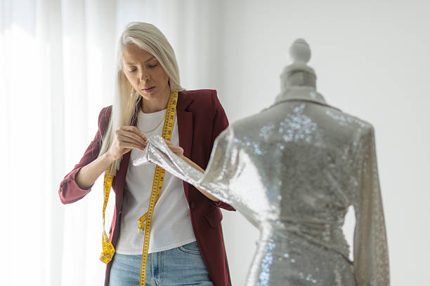 istock Woman working on a sequined garment in her studio 2255868209