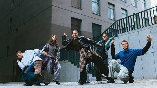 istock Hip hop group moving in sync during outdoor practice. 2255872336
