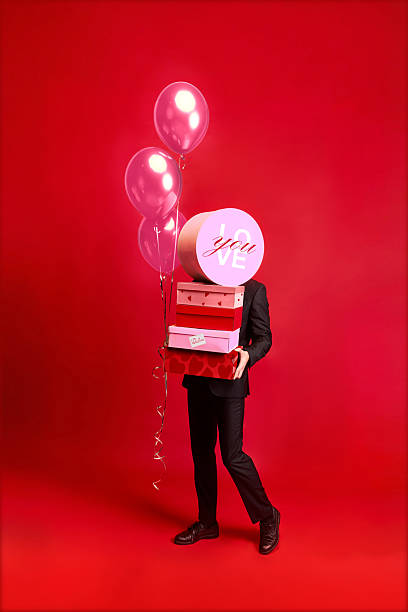 Modern collage with floating gift boxes on red background.