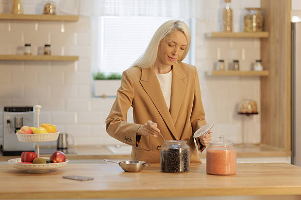 Woman preparing healthy meal in her kitchen