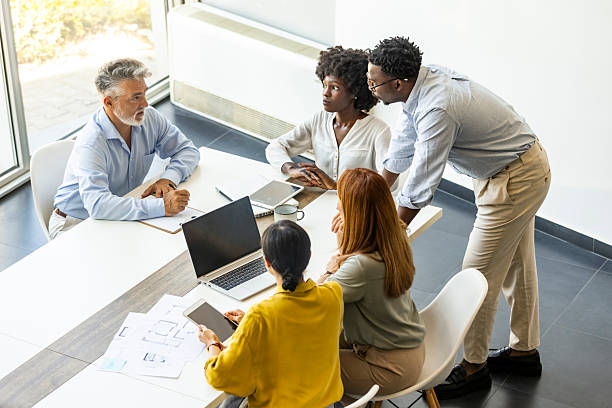 istock Business Meeting With Diverse Team Collaborating At Modern Conference Table 2255884871