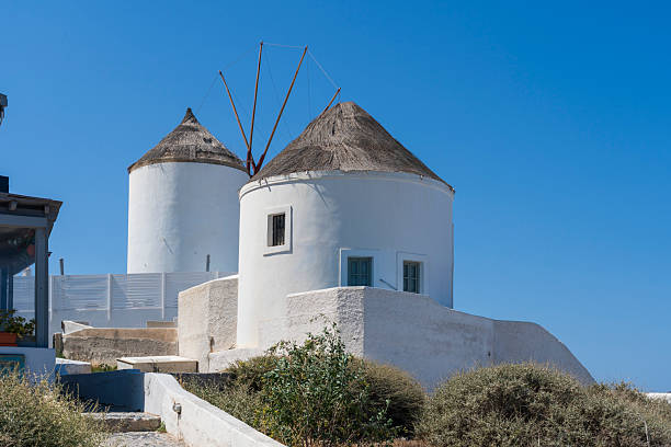 Traditional white windmill at Oia, Santorini, Greece, Europe